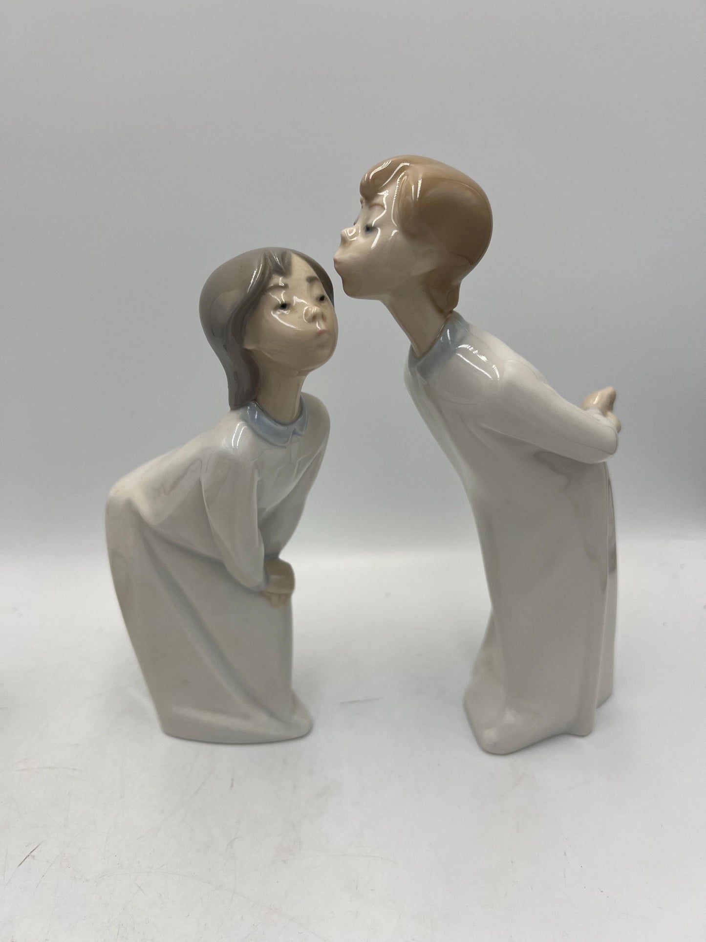Boy and Girl Kissing, "Kiss Me Goodnight" Lladro Porcelain Sculpture