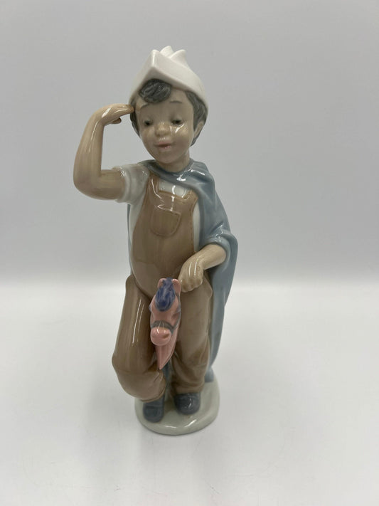 Boy on Hobby Horse Figurine: Lladro Little Conquistador - Porcelain Sculpture