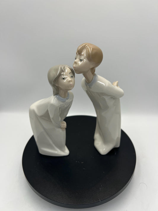 Boy and Girl Kissing, "Kiss Me Goodnight" Lladro Porcelain Sculpture