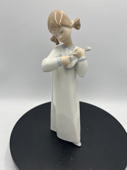 Lladro Statues, "How Pretty!" and "Girl with Guitar" Lladro Porcelain Sculpture - Sold Individually
