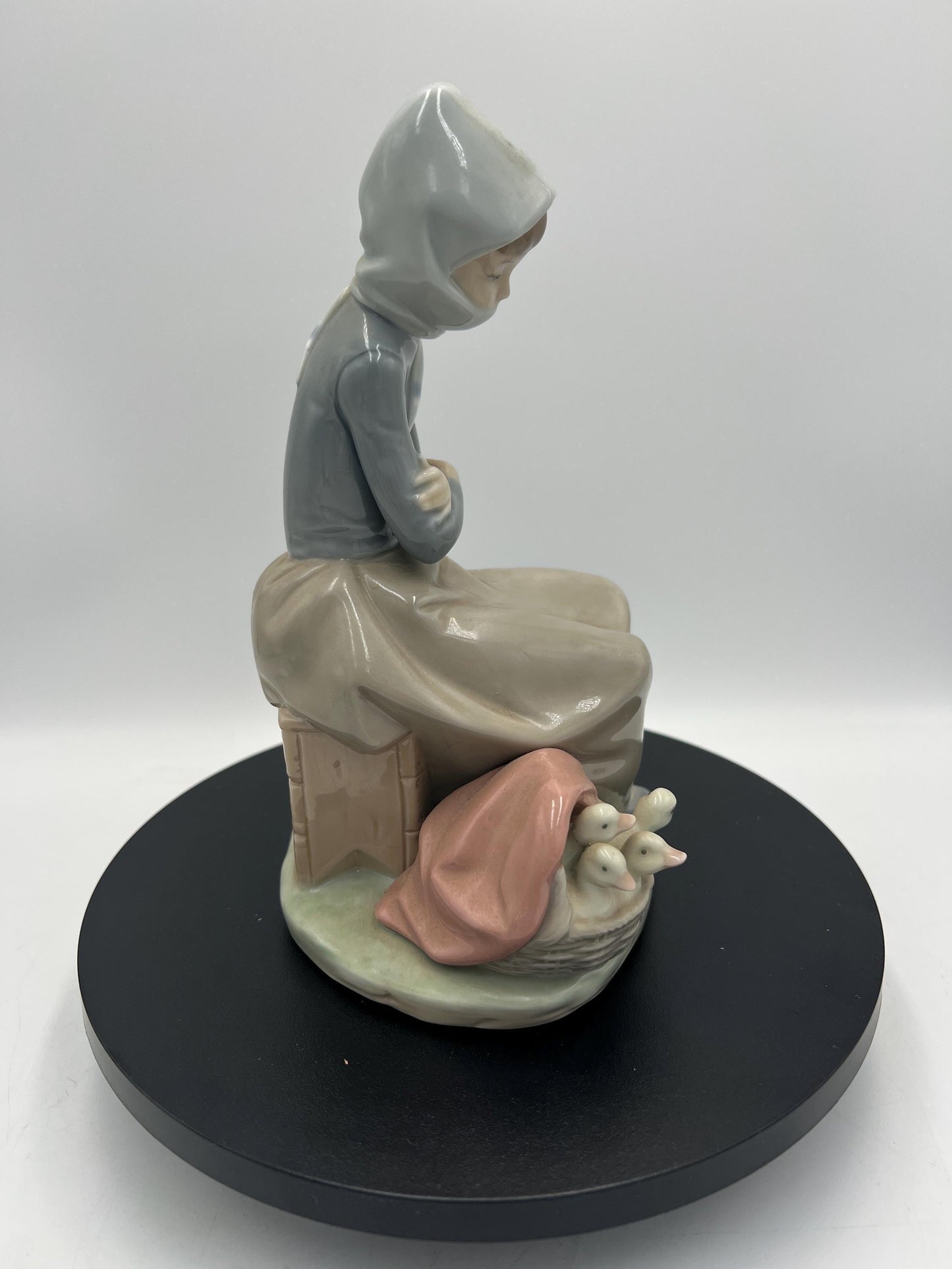 Lladro Statues, "Girl Gathering Flowers" and "Duck Seller" Lladro Porcelain Sculpture - Sold Individually