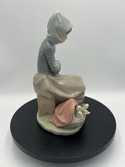 Lladro Statues, "Girl Gathering Flowers" and "Duck Seller" Lladro Porcelain Sculpture - Sold Individually
