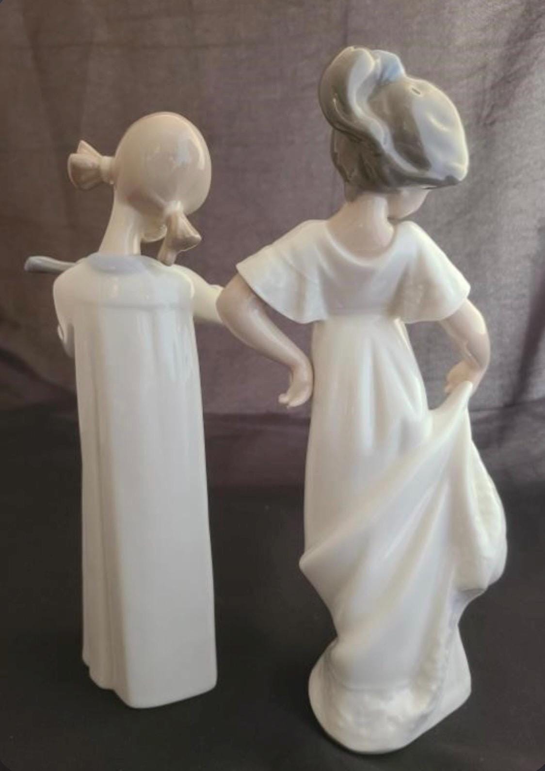 Lladro Statues, "How Pretty!" and "Girl with Guitar" Lladro Porcelain Sculpture - Sold Individually