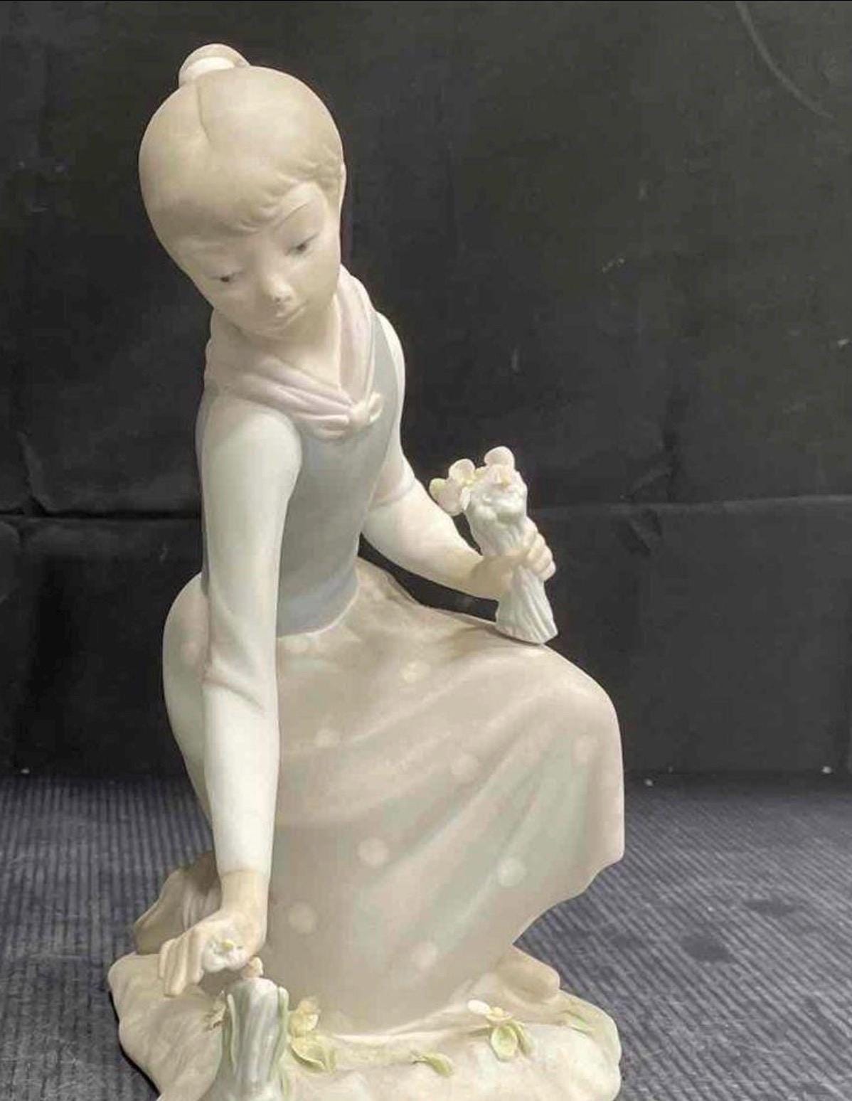 Lladro Statues, "Girl Gathering Flowers" and "Duck Seller" Lladro Porcelain Sculpture - Sold Individually