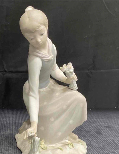 Lladro Statues, "Girl Gathering Flowers" and "Duck Seller" Lladro Porcelain Sculpture - Sold Individually