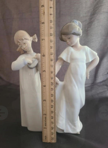 Lladro Statues, "How Pretty!" and "Girl with Guitar" Lladro Porcelain Sculpture - Sold Individually