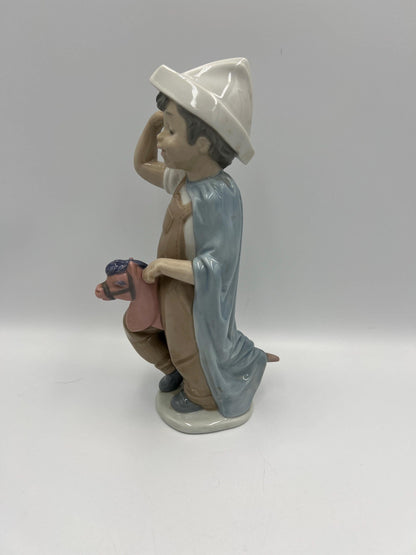 Boy on Hobby Horse Figurine: Lladro Little Conquistador - Porcelain Sculpture