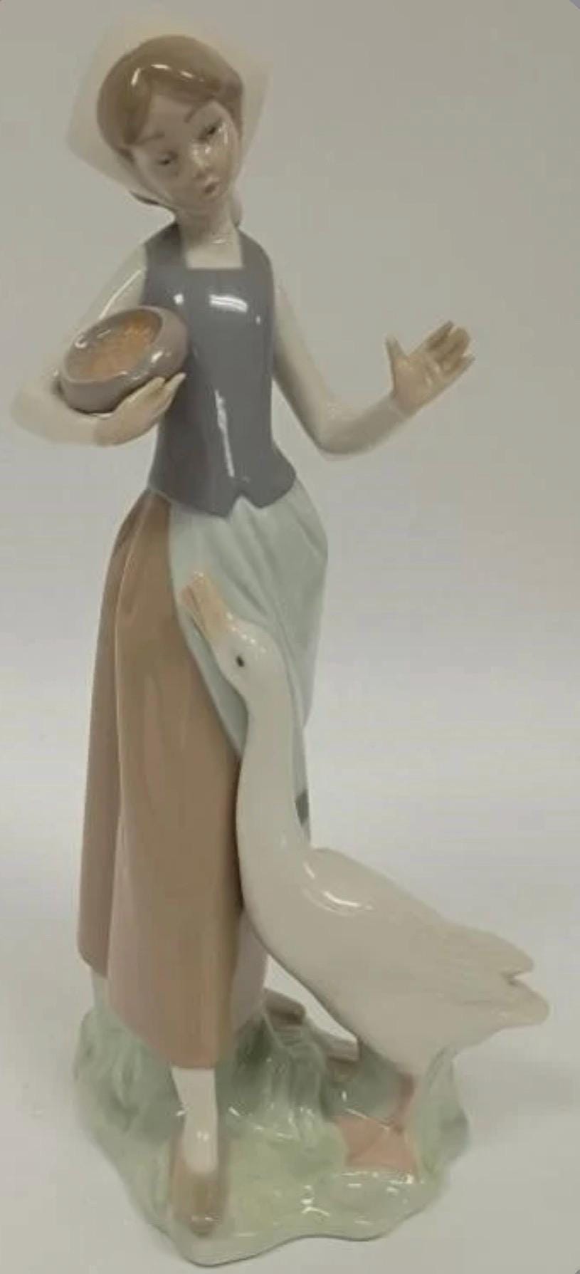 Girl Feeding Duck / Goose Figurine: Lladro - Porcelain Sculpture No. 1052. In original Box