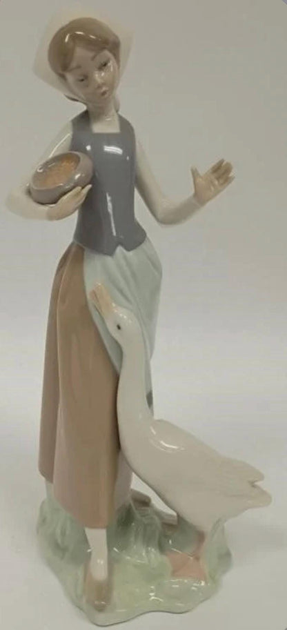 Girl Feeding Duck / Goose Figurine: Lladro - Porcelain Sculpture No. 1052. In original Box