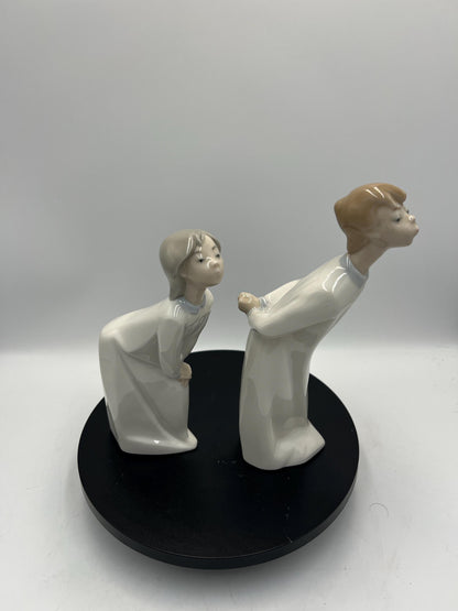Boy and Girl Kissing, "Kiss Me Goodnight" Lladro Porcelain Sculpture