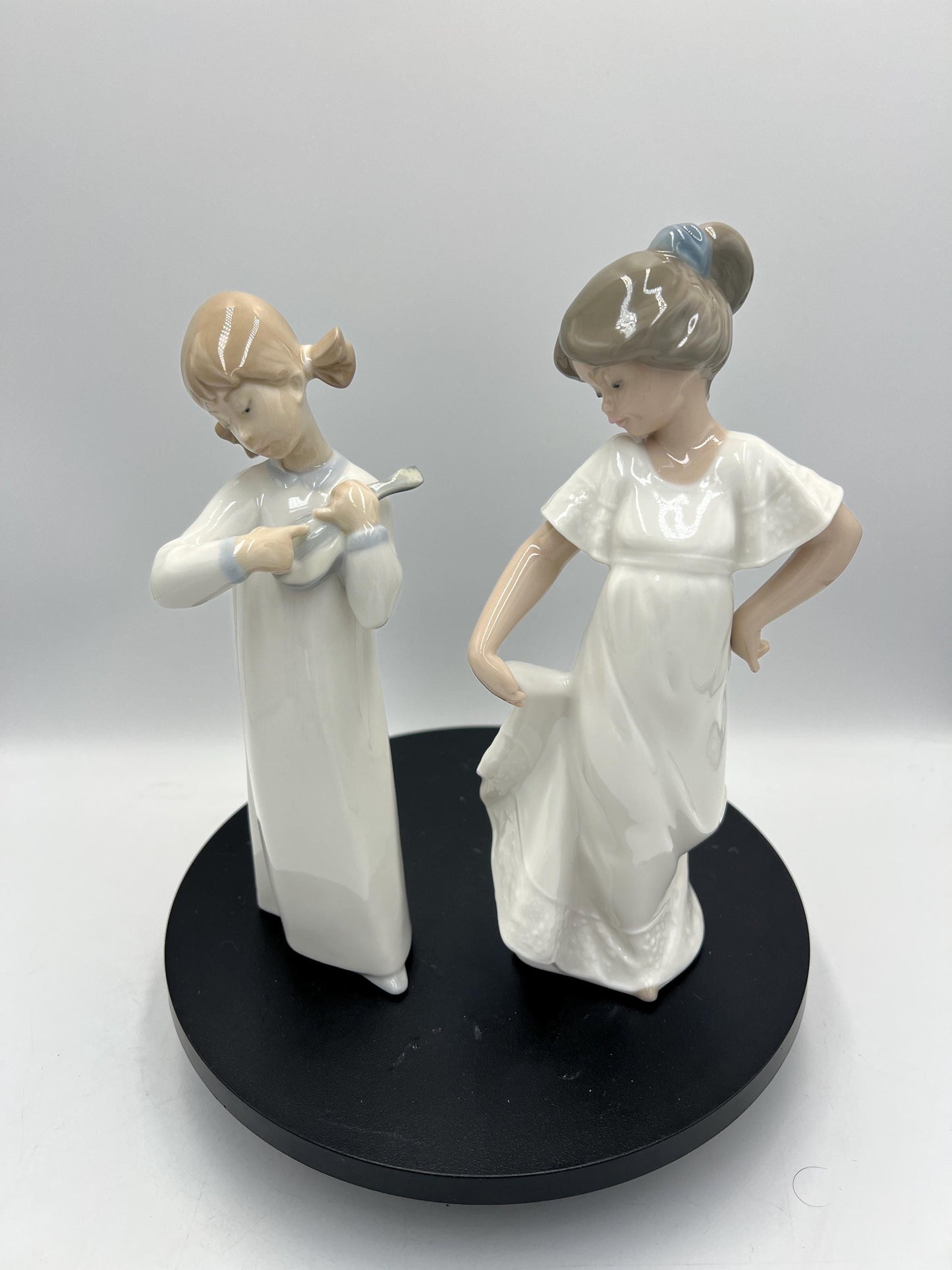 Lladro Statues, "How Pretty!" and "Girl with Guitar" Lladro Porcelain Sculpture - Sold Individually
