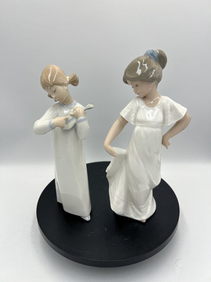 Lladro Statues, "How Pretty!" and "Girl with Guitar" Lladro Porcelain Sculpture - Sold Individually