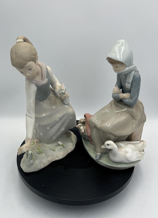 Lladro Statues, "Girl Gathering Flowers" and "Duck Seller" Lladro Porcelain Sculpture - Sold Individually