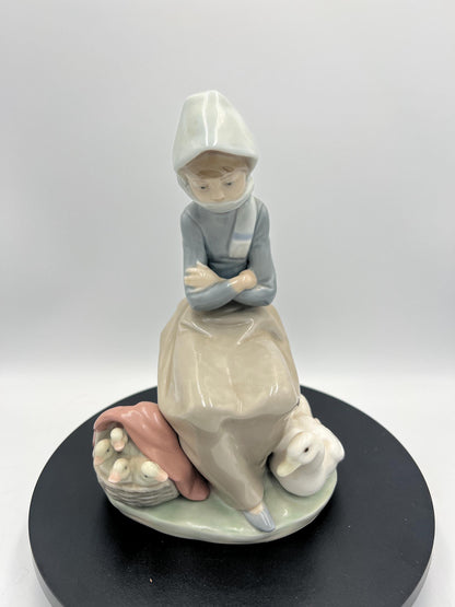 Lladro Statues, "Girl Gathering Flowers" and "Duck Seller" Lladro Porcelain Sculpture - Sold Individually