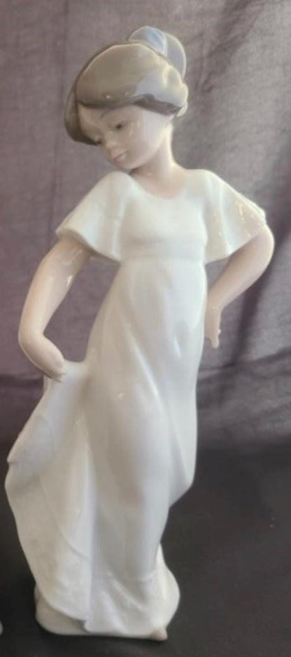 Lladro Statues, "How Pretty!" and "Girl with Guitar" Lladro Porcelain Sculpture - Sold Individually
