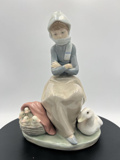 Lladro Statues, "Girl Gathering Flowers" and "Duck Seller" Lladro Porcelain Sculpture - Sold Individually