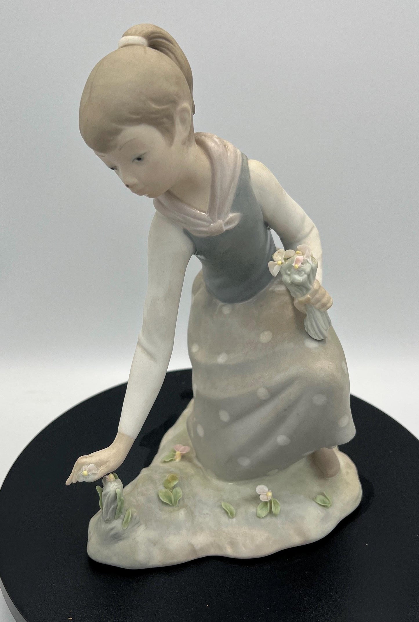 Lladro Statues, "Girl Gathering Flowers" and "Duck Seller" Lladro Porcelain Sculpture - Sold Individually