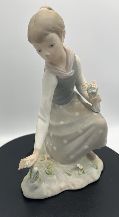 Lladro Statues, "Girl Gathering Flowers" and "Duck Seller" Lladro Porcelain Sculpture - Sold Individually