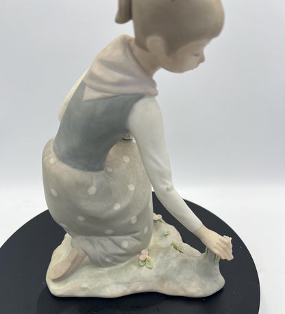 Lladro Statues, "Girl Gathering Flowers" and "Duck Seller" Lladro Porcelain Sculpture - Sold Individually